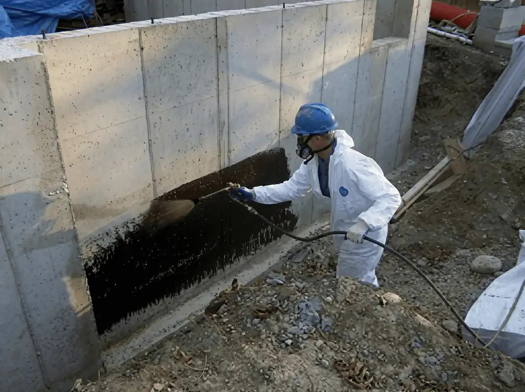 Professional waterproofing the exterior walls of the basement in Birmingham, AL