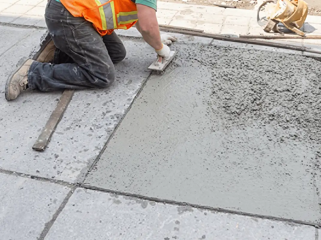 Professional repairing a concrete floor in Birmingham, AL
