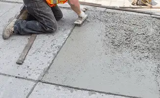 Professional repairing a concrete floor in Birmingham, AL
